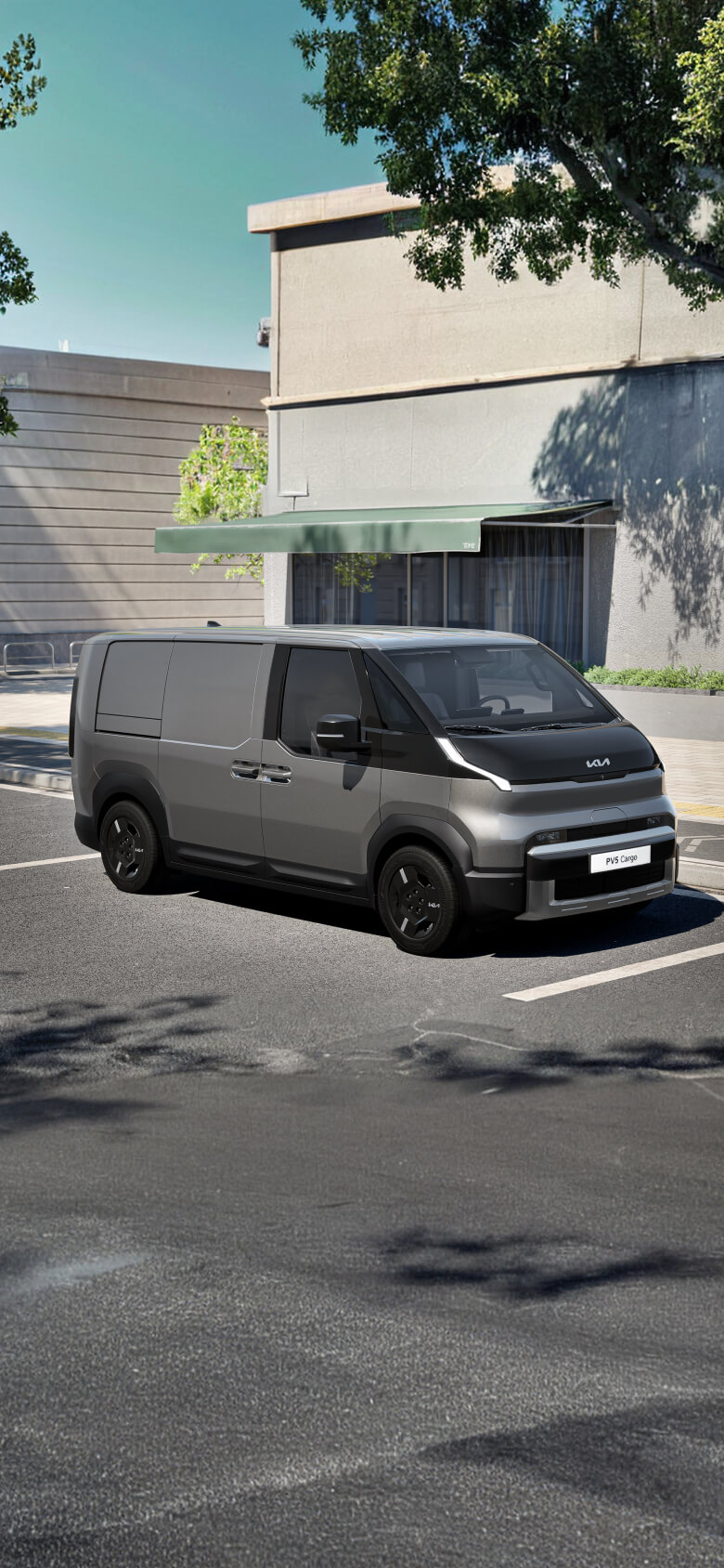 Front-side view of the Kia PV5 Cargo Long parked on an urban street