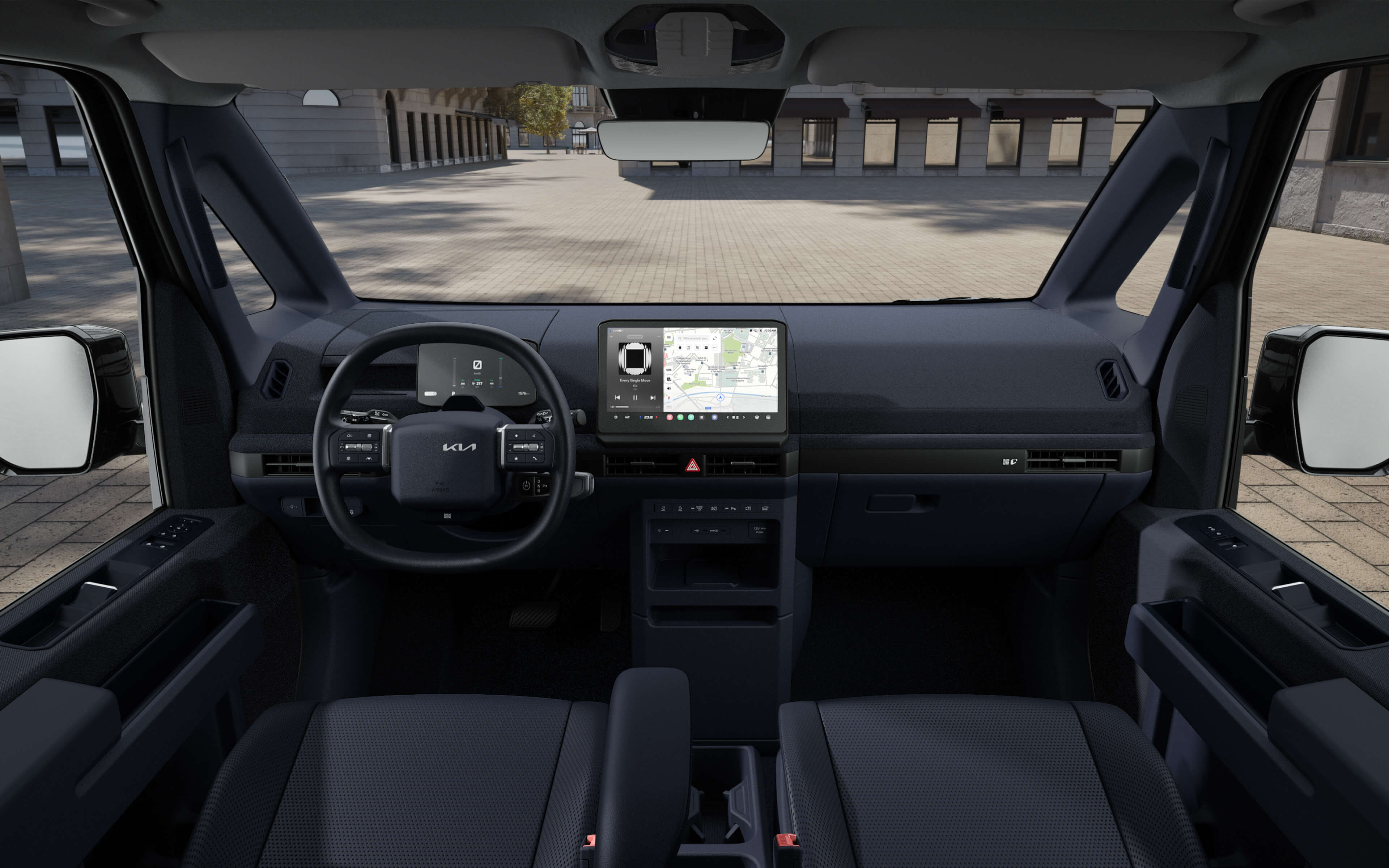 Front interior view of the Kia PV5 Cargo highlighting wide front view for safe driving, USB-C charging, and durable daily-use seating