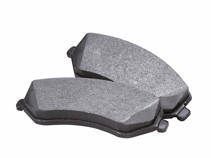 Service advisor showing the brake pad to a customer