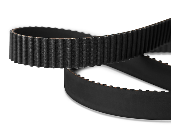 Mechanic presents a timing belt to the customer