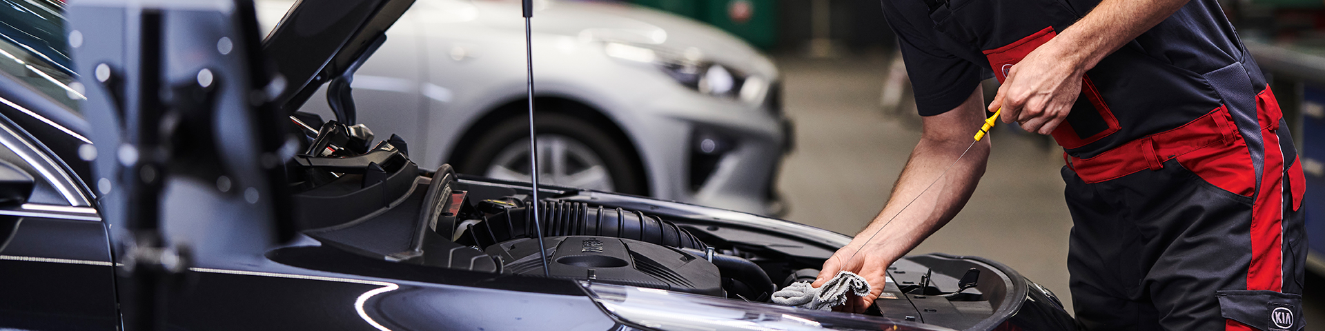 Customer speaking with service representative who is holding a genuine part