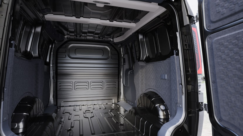 Interior cargo space of the Kia PV5 Cargo viewed from the rear doors, highlighting the wide and flat loading area