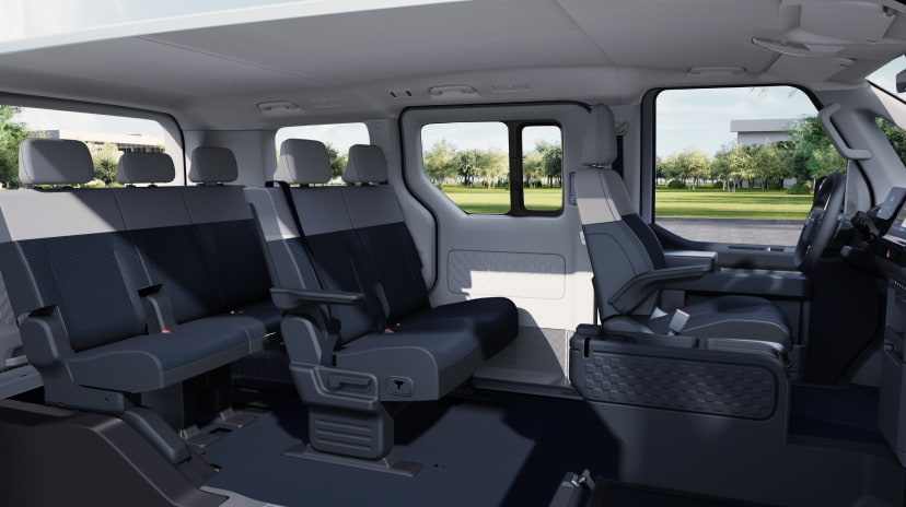 Side interior view of the Kia PV5 Passenger highlighting flexible rear seating configuration